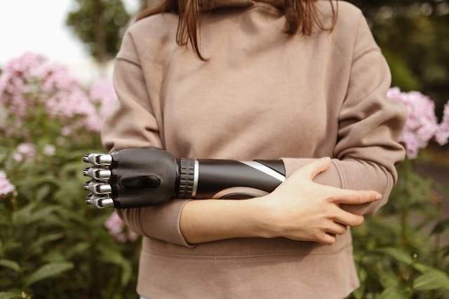 Haptic technology allows prosthetic limbs to replicate the sensation of touch by using pressure sensors, vibration motors, and electrical stimulation to send signals to the brain.